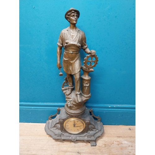 620 - Edwardian French spelter clock surmounted by blacksmith. {65 cm H x 26 cm W x 16 cm D}.