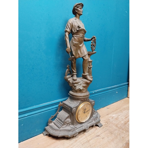 620 - Edwardian French spelter clock surmounted by blacksmith. {65 cm H x 26 cm W x 16 cm D}.