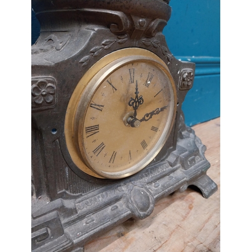 620 - Edwardian French spelter clock surmounted by blacksmith. {65 cm H x 26 cm W x 16 cm D}.