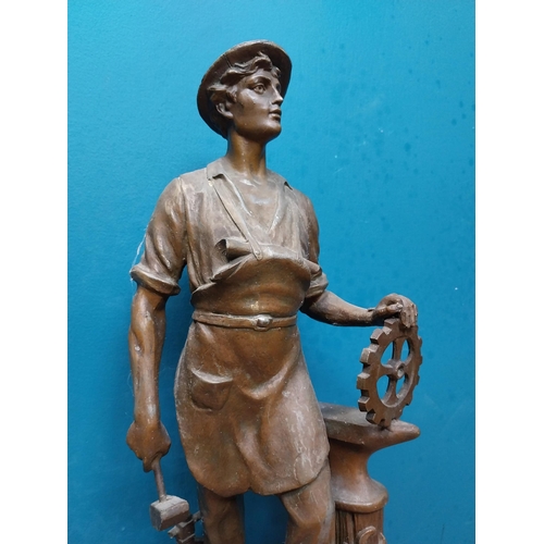 620 - Edwardian French spelter clock surmounted by blacksmith. {65 cm H x 26 cm W x 16 cm D}.