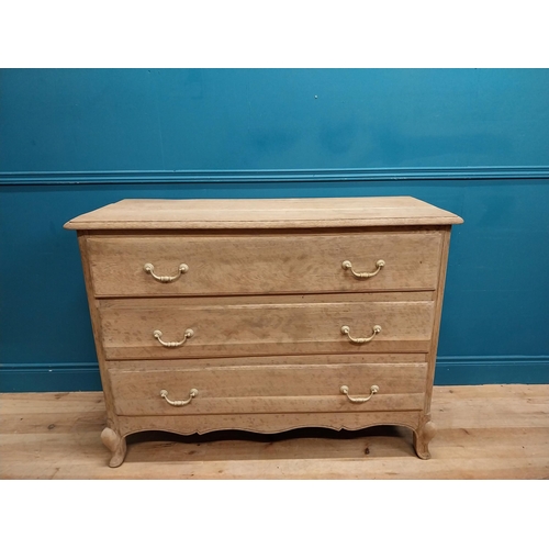 63 - 19th C. bleached oak French chest of drawers on cabriole legs. {91 cm H x 121 cm W x 51 cm D}.