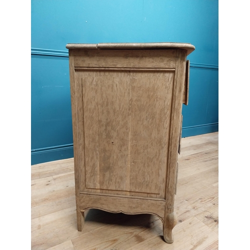 63 - 19th C. bleached oak French chest of drawers on cabriole legs. {91 cm H x 121 cm W x 51 cm D}.