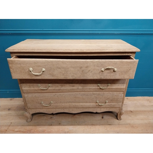 63 - 19th C. bleached oak French chest of drawers on cabriole legs. {91 cm H x 121 cm W x 51 cm D}.