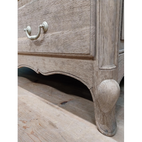 63 - 19th C. bleached oak French chest of drawers on cabriole legs. {91 cm H x 121 cm W x 51 cm D}.