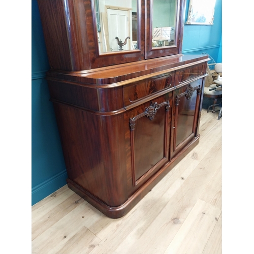 634 - Exceptional quality Victorian flamed mahogany bookcase with two mirrored doors above two drawers abo... 