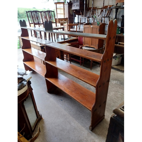 637 - Early 20th C. pitch pine open bookshelves {155 cm H x 270 cm W x 30 cm D}.