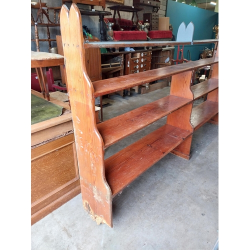 637 - Early 20th C. pitch pine open bookshelves {155 cm H x 270 cm W x 30 cm D}.