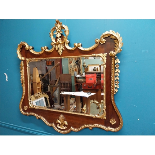 638 - 19th C. walnut and partial gilt wall mirror decorated with leaves and flowers. {107 cm H x 111 cm W}... 