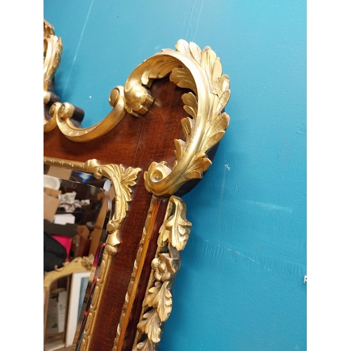 638 - 19th C. walnut and partial gilt wall mirror decorated with leaves and flowers. {107 cm H x 111 cm W}... 