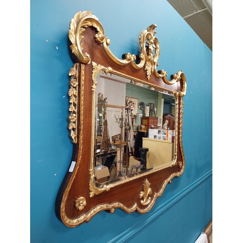 638 - 19th C. walnut and partial gilt wall mirror decorated with leaves and flowers. {107 cm H x 111 cm W}... 