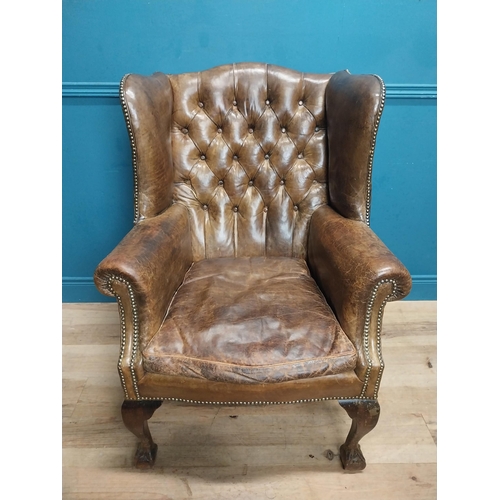 71 - Early 20th C. hand dyed deep buttoned leather wing back arm chair. {106 cm H x 80 cm W x 82 cm D}.