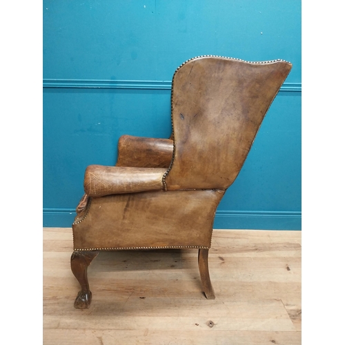 71 - Early 20th C. hand dyed deep buttoned leather wing back arm chair. {106 cm H x 80 cm W x 82 cm D}.