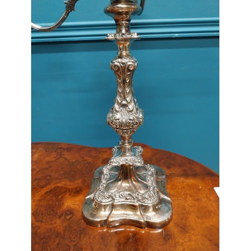 74 - Pair of silverplate four branch candelabras {55 cm H x 49 cm W x 49 cm D}.