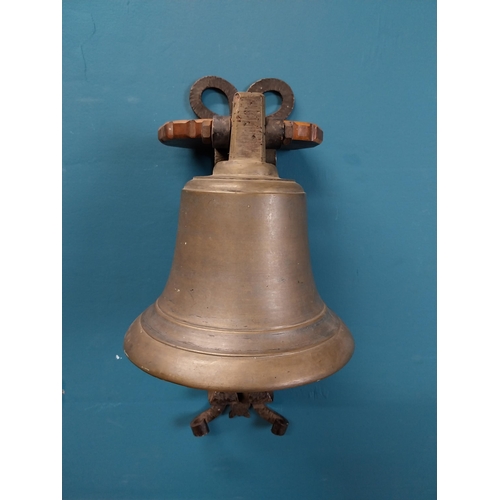 84 - Bronze wall bell with original bracket. {50 cm H x 24 cm W x 30 cm D}.