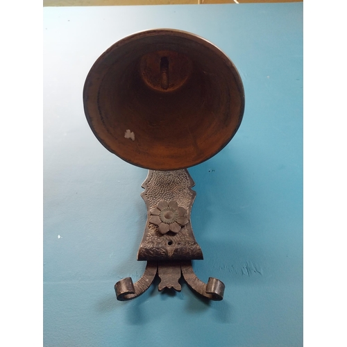 84 - Bronze wall bell with original bracket. {50 cm H x 24 cm W x 30 cm D}.