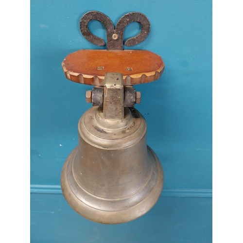 84 - Bronze wall bell with original bracket. {50 cm H x 24 cm W x 30 cm D}.