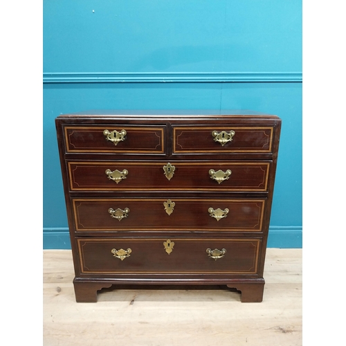 87 - Georgian mahogany chest of drawers with two short drawers over three long drawers and brass handles.... 