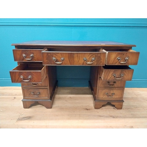 9 - Mahogany desk with tooled leather top in the Georgian style. {77 cm H x 120 cm W x 60 cm D}.