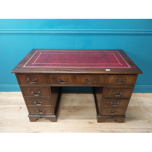 9 - Mahogany desk with tooled leather top in the Georgian style. {77 cm H x 120 cm W x 60 cm D}.