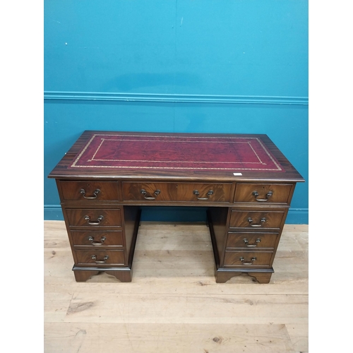 9 - Mahogany desk with tooled leather top in the Georgian style. {77 cm H x 120 cm W x 60 cm D}.