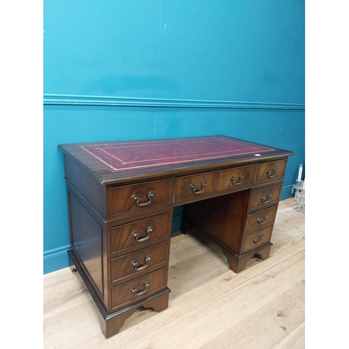 9 - Mahogany desk with tooled leather top in the Georgian style. {77 cm H x 120 cm W x 60 cm D}.