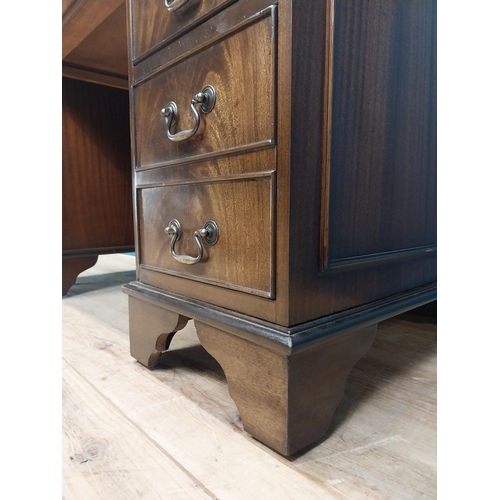 9 - Mahogany desk with tooled leather top in the Georgian style. {77 cm H x 120 cm W x 60 cm D}.