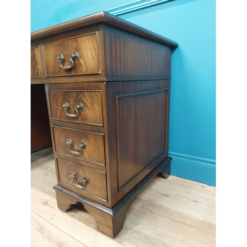 9 - Mahogany desk with tooled leather top in the Georgian style. {77 cm H x 120 cm W x 60 cm D}.