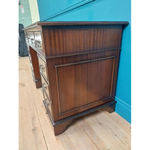 9 - Mahogany desk with tooled leather top in the Georgian style. {77 cm H x 120 cm W x 60 cm D}.