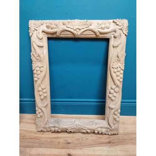 91 - Small highly carved pine picture frame. {76 cm H x 54 cm W x 6 cm D}.