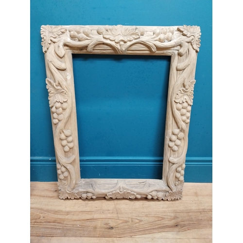 91 - Small highly carved pine picture frame. {76 cm H x 54 cm W x 6 cm D}.