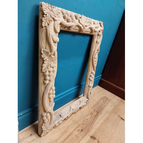 91 - Small highly carved pine picture frame. {76 cm H x 54 cm W x 6 cm D}.