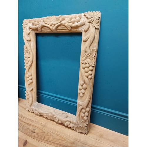 91 - Small highly carved pine picture frame. {76 cm H x 54 cm W x 6 cm D}.