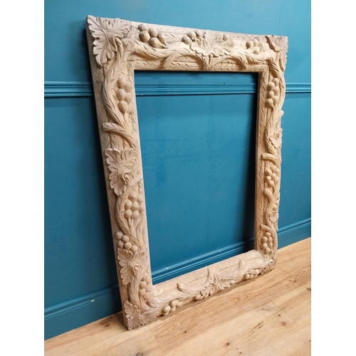 92 - Large highly carved pine picture frame. {120 cm H x 90 cm W x 8 cm D}.