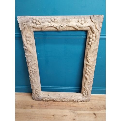 92 - Large highly carved pine picture frame. {120 cm H x 90 cm W x 8 cm D}.