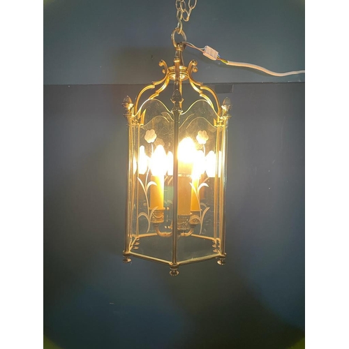 218 - Good quality brass hall lantern with etched glass panels in the Victorian style {}.