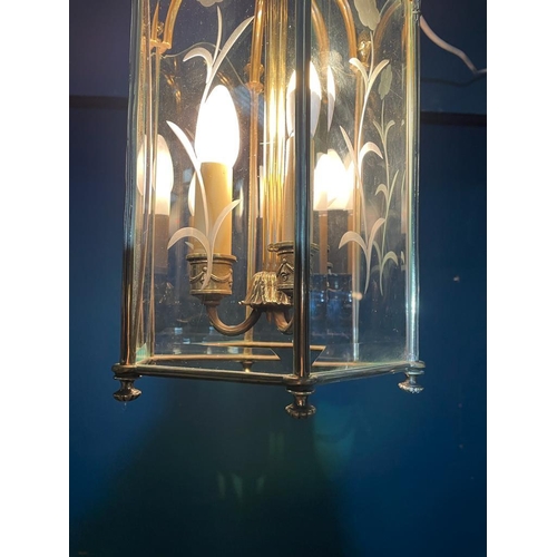 218 - Good quality brass hall lantern with etched glass panels in the Victorian style {}.