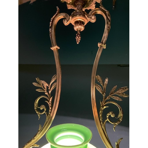 315 - Edwardian gilded brass hanging light fitting with green glass shade {}.