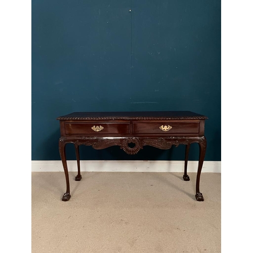 374 - Edwardian Irish mahogany side table with two drawers in the frieze raised on cabriole legs and ball ... 