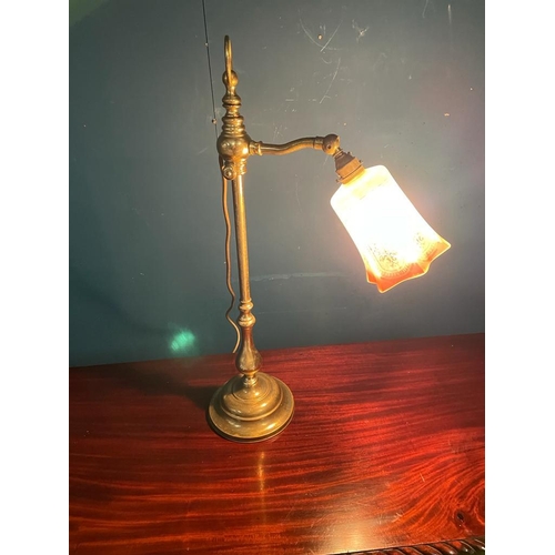 412 - Edwardian brass students lamp with red glass shade {50 cm H x 30 cm W}.