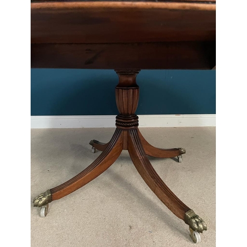 422 - Good quality Regency mahogany and cross banded rosewood circular dining table raised on turned colum... 