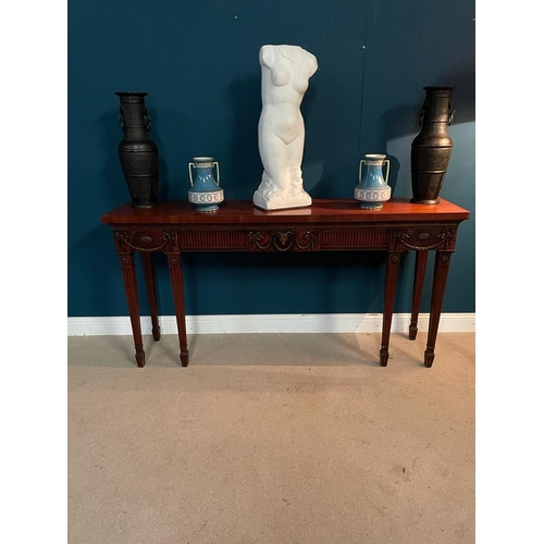 456 - Good quality mahogany side table decorated with swags and rams head raised on square tapered legs in... 