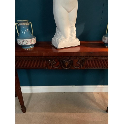 456 - Good quality mahogany side table decorated with swags and rams head raised on square tapered legs in... 