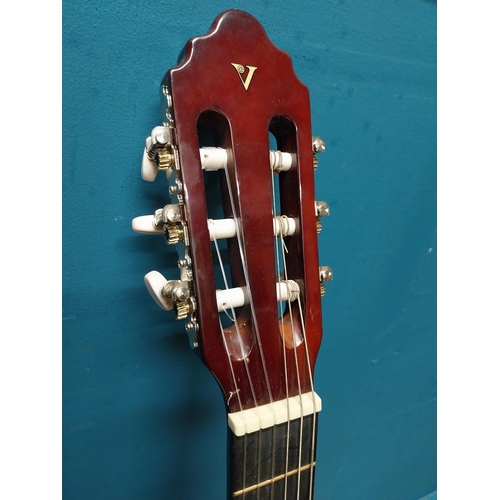 565 - Valencia 6 string left handed acoustic Guitar {94 cm H x 31 cm W x 10 cm D}.