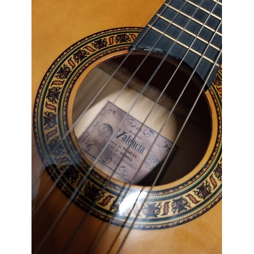 565 - Valencia 6 string left handed acoustic Guitar {94 cm H x 31 cm W x 10 cm D}.