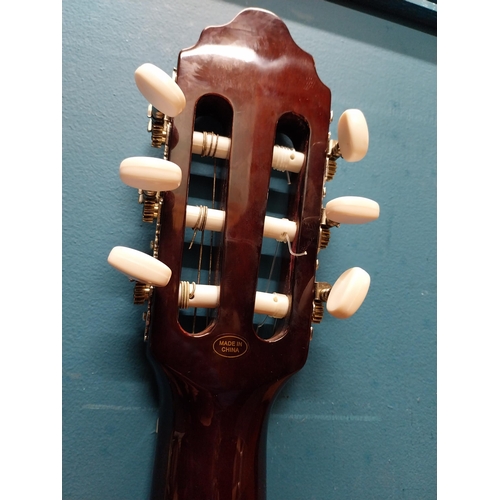 565 - Valencia 6 string left handed acoustic Guitar {94 cm H x 31 cm W x 10 cm D}.