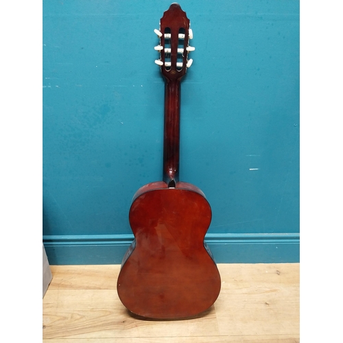 565 - Valencia 6 string left handed acoustic Guitar {94 cm H x 31 cm W x 10 cm D}.