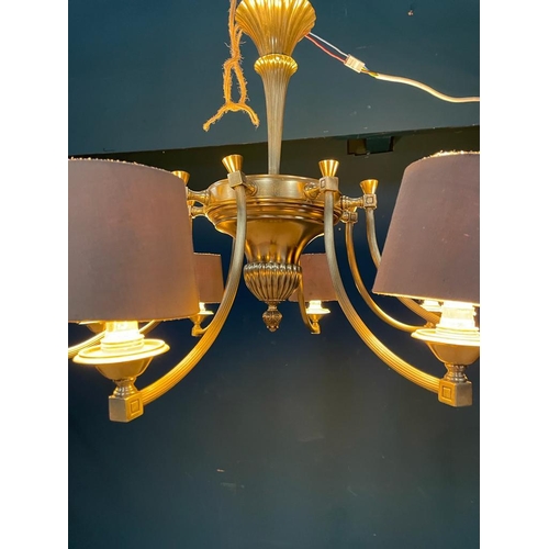 95 - Good quality Edwardian brass eight branch chandelier with cloth shades {}.