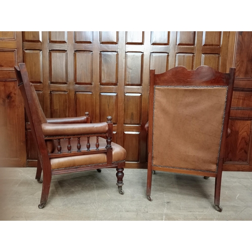 470 - Pair of oak fireside chairs with tan leather on turned front legs with castors {H 105cm x W 66cm x D... 