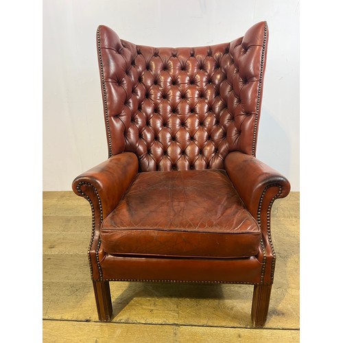 303 - Fireside-wingback red  hand buttoned back leather chair {H 110cm x W 76cm x D 60cm } (NOT AVAILABLE ... 