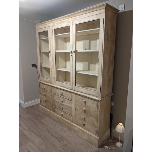 606 - Country lime wash pine kitchen dresser, with three mesh doors above four central drawers flanked by ... 